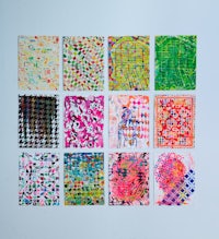 a group of colorful paintings on a white surface