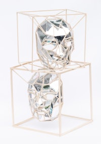 a pair of mirrors in a wooden box
