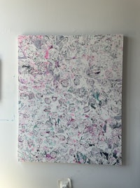 a painting with pink and purple paint on the wall